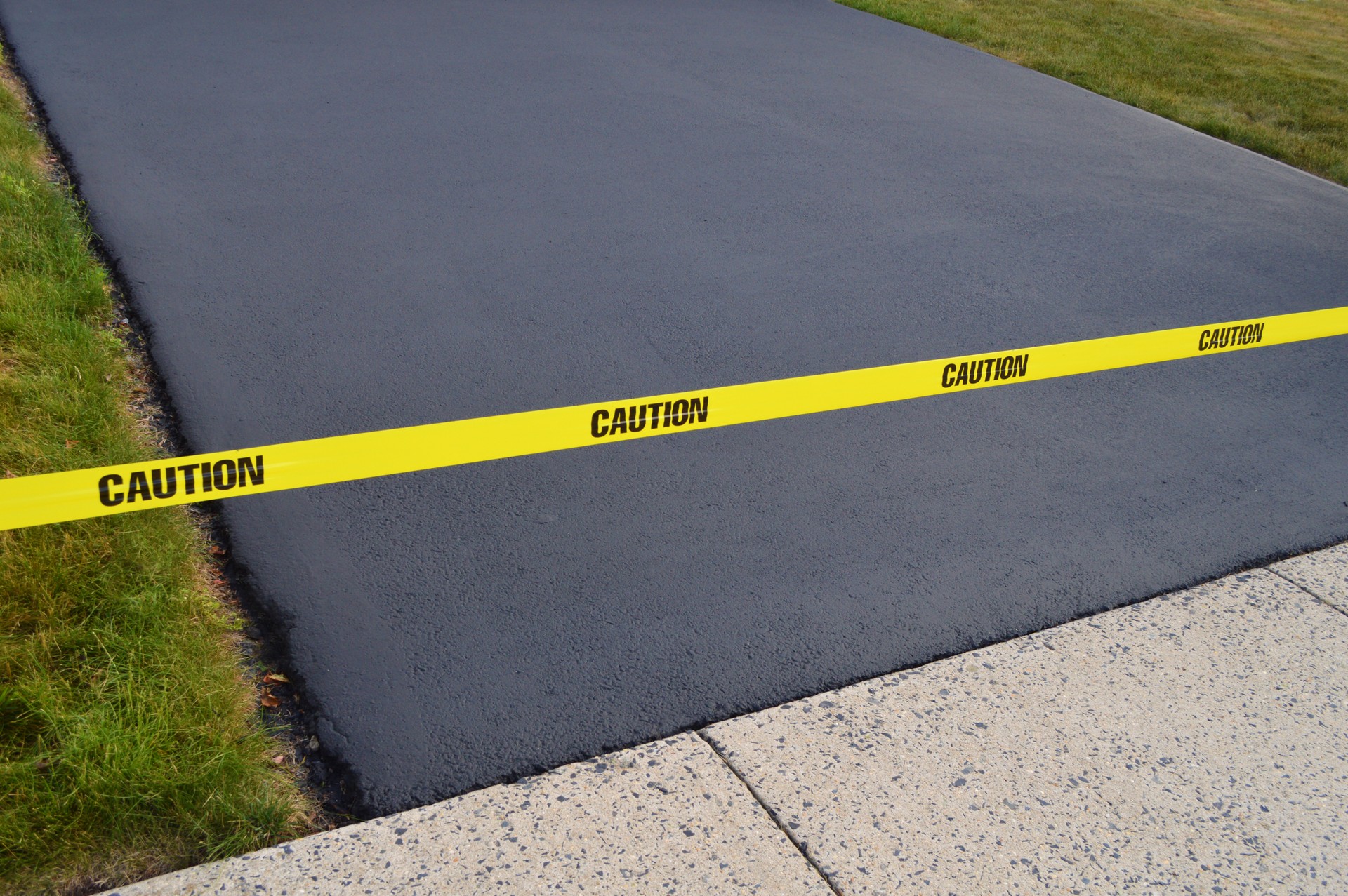 Fresh Seal Coated Driveway Meets Sidewalk